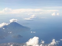 In the foreground Ternate island and Gamalama volcano.